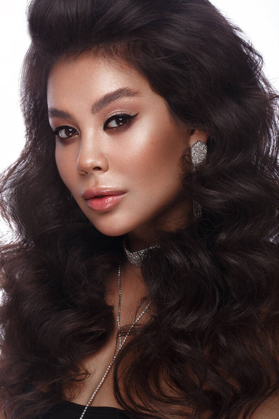 Beautiful Asian brunette model : volume curls, classic makeup and sexy lips. The beauty face. - Fotografie, Obrázek