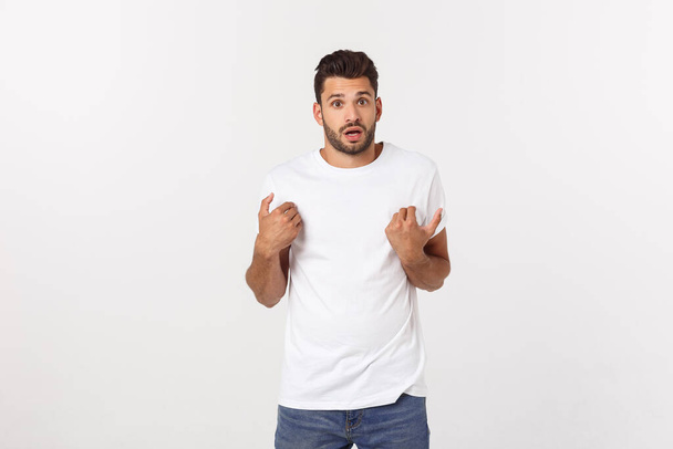 Close up portrait of disappointed stressed bearded young man in shirt over white background. - Zdjęcie, obraz