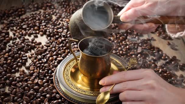 Coffee with steam poured from a coffee pot into a cup - Footage, Video