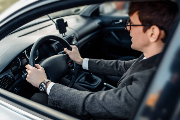 Business young businessman driving a car, going to work - Foto, Imagen