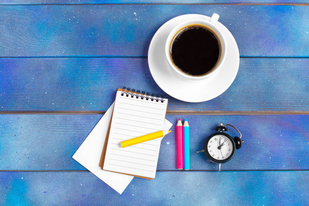 Mockup for check list, empty note paper with coffee cup on blue wood background. Office, writer or study concept - Photo, image