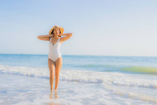 Portrait beautiful young asian woman happy smile around sea ocean beach and blue sky for leisure travel vacation - Foto, immagini