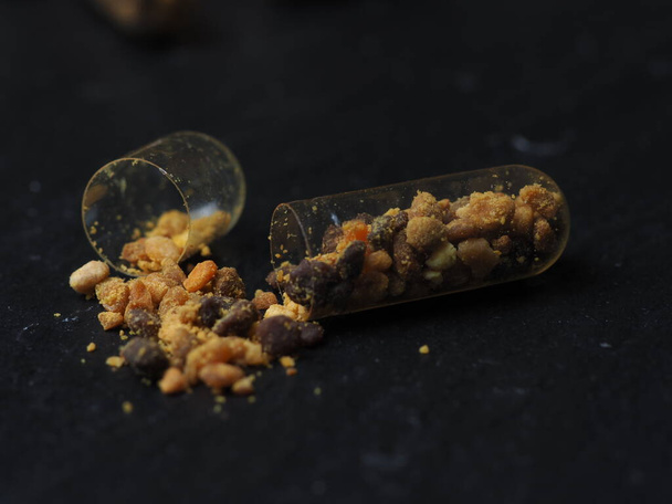 Bee pollen grains  in clear capsules for daily use. Healthy natural medicine for influenza. - Photo, Image