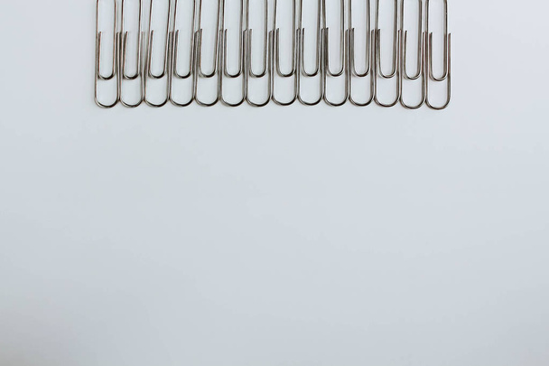 Metal paper clips on white - Fotó, kép