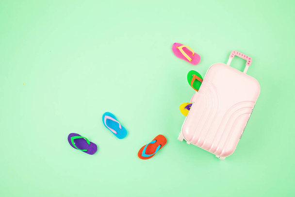 Travel baggage suitcase with summer vacations accessories. Summer holidays, travel to tropical countries, seaside, summertime style concept. Top view, flat lay - Valokuva, kuva