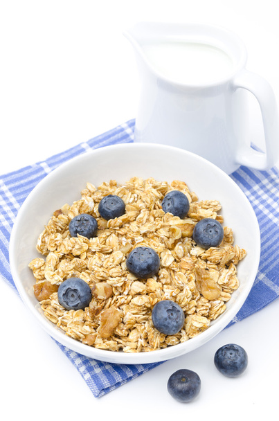 muesli with blueberries and jug of milk isolated on white - Fotoğraf, Görsel
