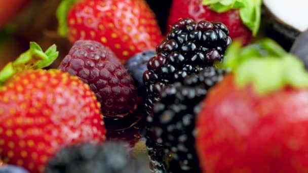 4k macro video of lots of fresh tasty berries lying on the table. Perfect abstract backdrop for culinary or healthy food. - Footage, Video