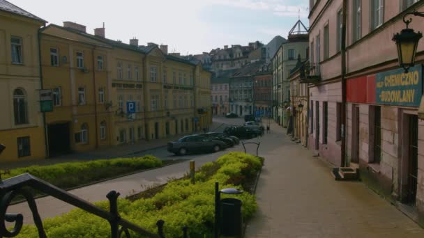 A close up of a street in front old rowhouse buildings in Lublin, Poland - Footage, Video