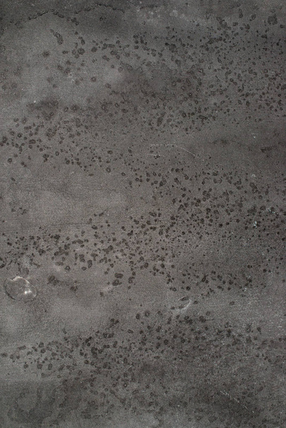 Concrete texture background in black and grey colors. small spots of spray. - Photo, Image