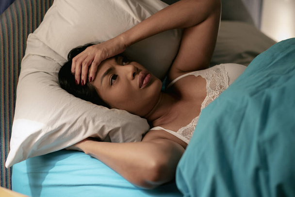 Insomnia Woman. Sad Depressed Lady on Bed. Seriously Unhappy. Sleepless at Night. The Protection and Treatment of Major Depressive Disorder Problem Concept. - Photo, Image