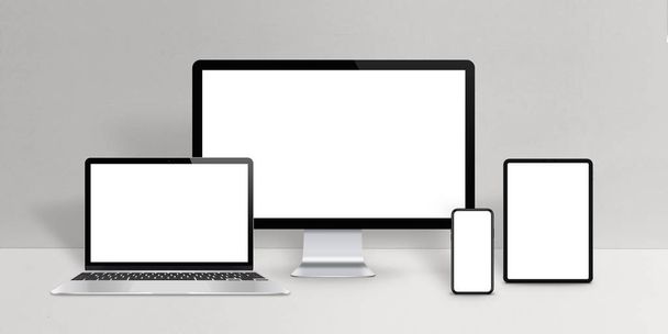 Responsive Design-Geräte-Attrappe. Laptop, Computerdisplay, Telefon und Tablet mit isoliertem Bildschirm auf dem Schreibtisch - Foto, Bild