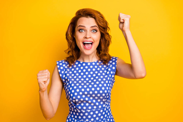 Close-up portrait of her she nice attractive lovely overjoyed glad cheerful cheery wavy-haired girl celebrating great victory isolated on bright vivid shine vibrant yellow color background - Valokuva, kuva