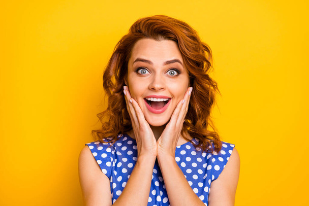 Close-up portrait of her she nice attractive lovely charming cute pretty cheerful cheery wavy-haired girl good news reaction pleasure isolated over bright vivid shine vibrant yellow color background - 写真・画像