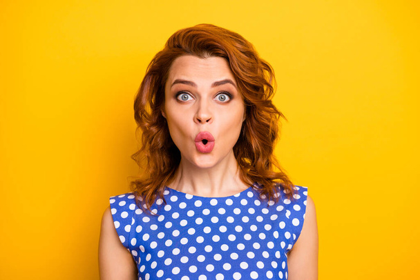 Portrait of crazy astonished girl stare unbelievable promo impressed scream wear vintage style polka-dot shirt isolated over vibrant color background - 写真・画像