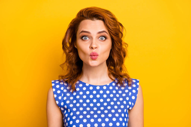 Close-up portrait of her she nice attractive lovely lovable winsome girlish affectionate cheerful wavy-haired girl sending air kiss isolated over bright vivid shine vibrant yellow color background - Zdjęcie, obraz