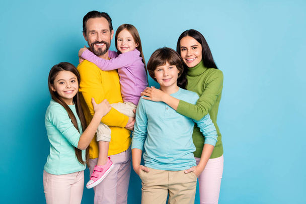 Portrait of nice attractive lovely adorable perfect tender cheerful cheery family schoolkids teenage embracing growing-up isolated on bright vivid shine vibrant blue color background - Foto, Bild