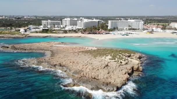 Drone view of sea with beach and hotel resorts in Aya Napa city, Cyprus - Πλάνα, βίντεο