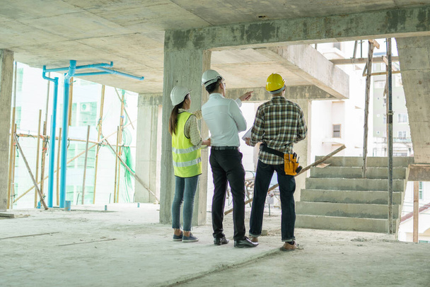 professional engineer planning with team young architect with friendly at site construction work - Φωτογραφία, εικόνα