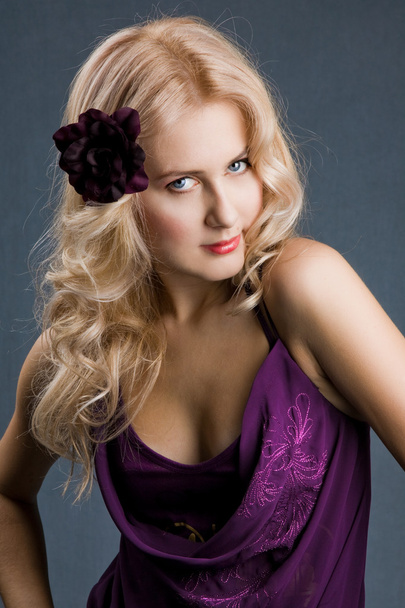 Beautiful blonde girl in purple dress - 写真・画像