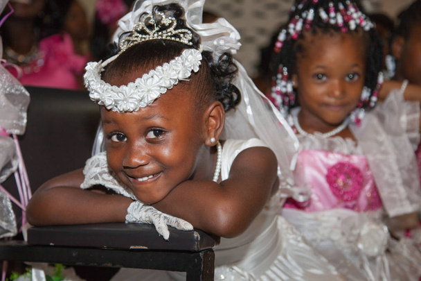 Funny little girls in wedding dresses at the wedding. Selective focus. Very cute kids in the Wedding Ceremony,  children family happiness. - Photo, Image