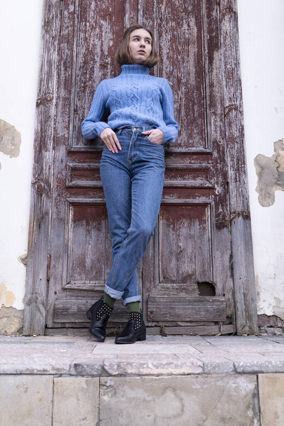 Beautiful young girl with long hair in the blue jeans - Fotografie, Obrázek