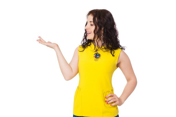 brunette happy girl with curly hair wearing yellow blouse and bl - Zdjęcie, obraz