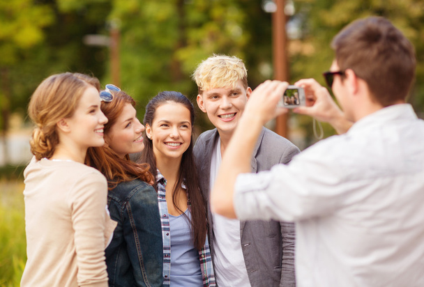 Teenagers taking photo outside - Fotó, kép