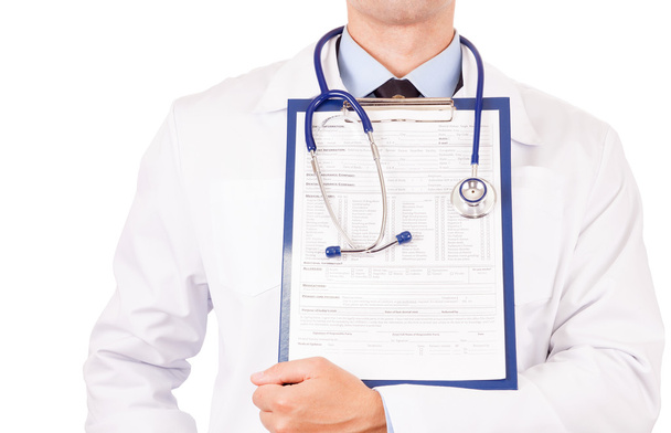 Doctor holding clipboard - Foto, afbeelding
