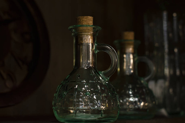 Glass vessels under olive oil. - Fotoğraf, Görsel