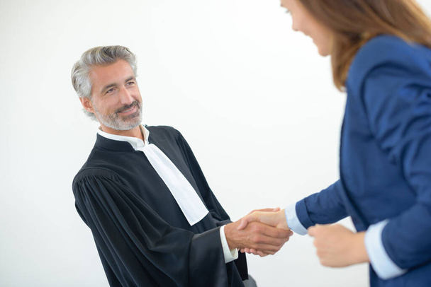 lawyer shaking hand to client after meeting - Foto, afbeelding