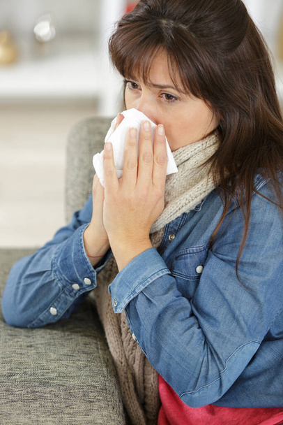 sick woman blows her nose - Photo, Image