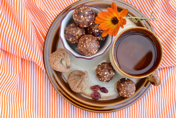 Fig cranberry quinoa energy balls served with coffee - Photo, Image