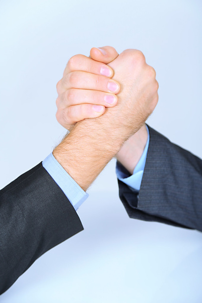 Arm wrestling: business concept isolated on white - Zdjęcie, obraz