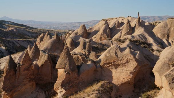 Dry landscape of the Cappadocia with weird and beautiful rocks, Central Anatolia, Turkey. - Φωτογραφία, εικόνα