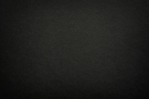 Black matte paper texture background. Surface of abstract dark texture. Gray blank page background flat close up view. - Foto, Bild