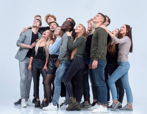 large group of diverse young people looking up hopefully - Fotoğraf, Görsel
