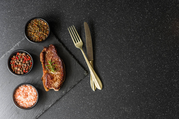 New york strip loin beef steak meat with chimichurri sauce. - 写真・画像