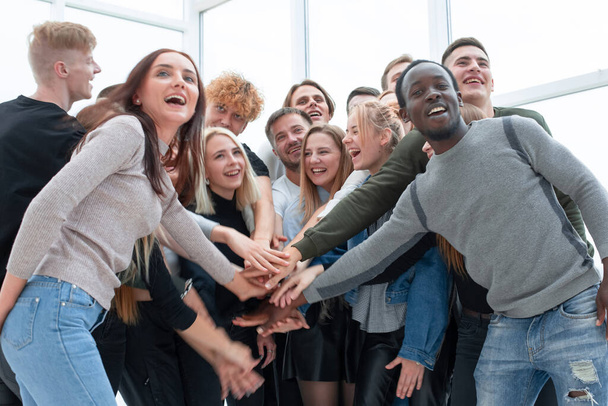 group of happy young people showing their unity - 写真・画像
