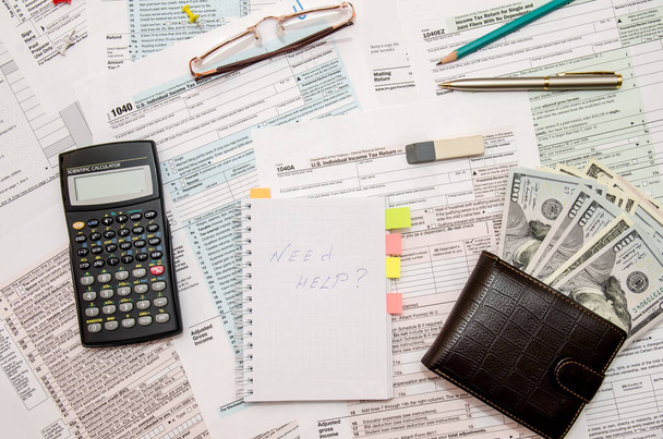 1040 Tax form with money, calculator, pen, glasses - Fotoğraf, Görsel