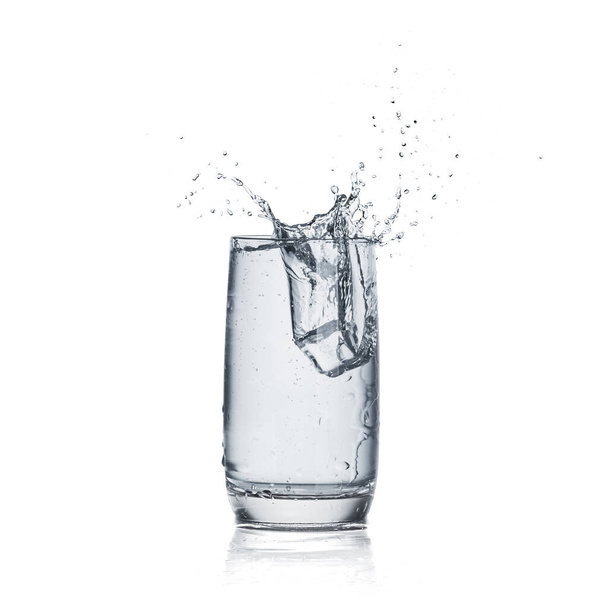 Glass of clear water on white background - Valokuva, kuva