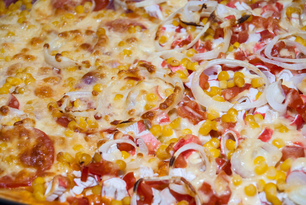 pizza with tomatoes, chicken, corn, crab sticks and cheese - Photo, Image
