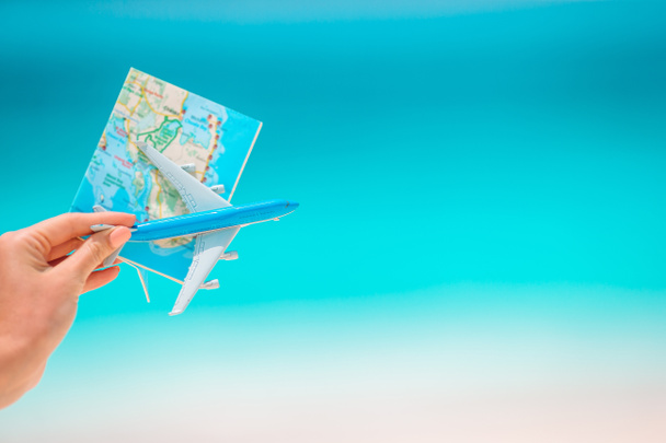 Closeup of map and model airplane background the sea - Photo, Image