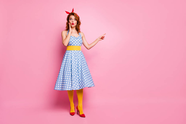 Full body photo of impressed lady look point index finger incredible discounts scream wow omg suggest pick tips wear blue polka-dot tights isolated over pink color background - Foto, immagini