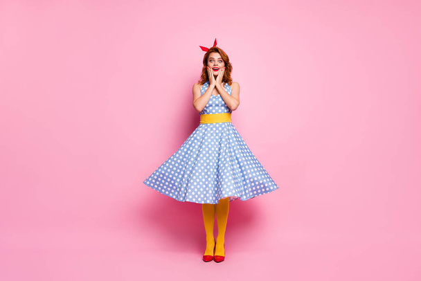 Full size photo astonished trend elegant dreamy lady fun weekend look incredible novelty touch hands face scream wow omg wear blue polka-dot yellow stockings isolated pink color background - Φωτογραφία, εικόνα
