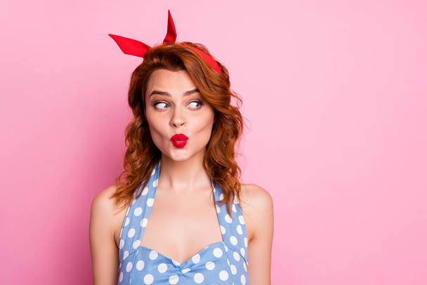 Close up photo of sweet lovely girl woman look copyspace send air kiss plan tricky things wear blue polka-dot outfit isolated over pastel pink color background - Foto, immagini
