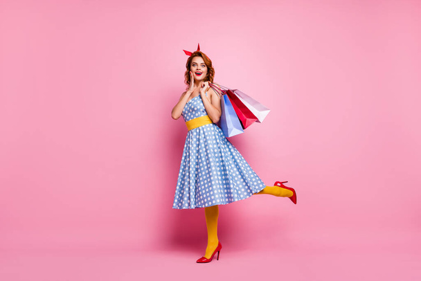 Full size photo cute sweet fancy girl tourist shopping center client enjoy off-sales bargain scream hold bags wear blue red high-heels headband yellow stockings isolated pink color background - Fotó, kép