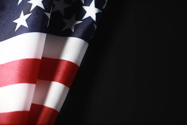American flag on a mirror background. Symbol of the United States of America. Star-striped flag on black background. - Photo, Image