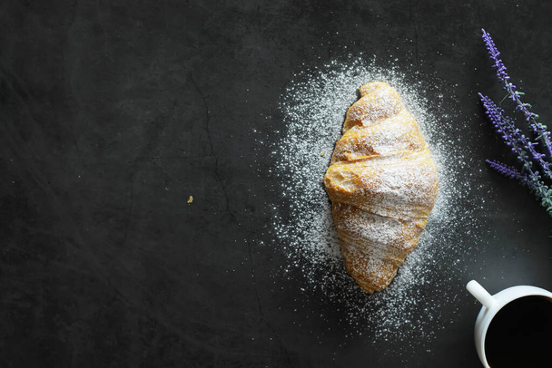 Fresh pastries on the table. French flavored croissant for breakfast. - Фото, изображение