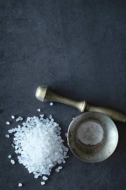 Large sea salt. Spice. Mortar and pestle for grinding salt. - Photo, Image