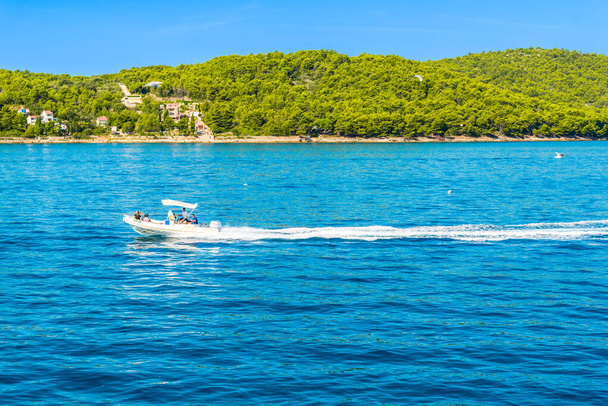 Kornati near Zadar, Croatia - AUG 18, 2019: Scenic view of bay Mediterranean Sea and speed boat at the coast of lagoon with with turquoise water, paradise island in Dalmatia, Croatia, Europe - Фото, зображення